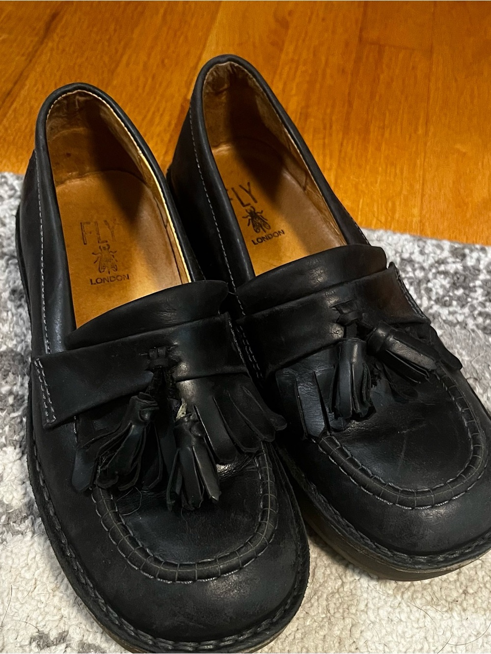 Fly London Black Leather Tassel Slip-Ons